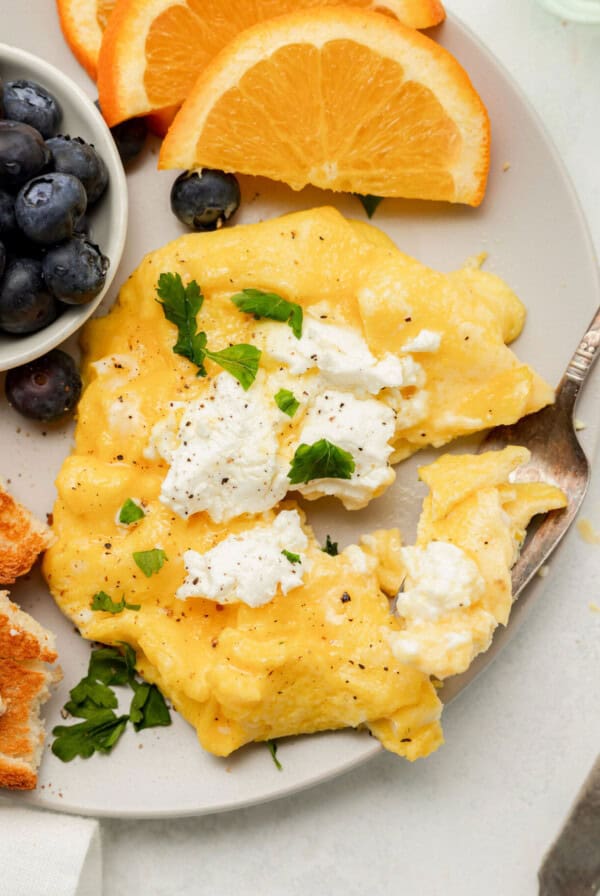 Say goodbye to dry scrambled eggs and hello to these goat cheese soft scrambled eggs. Here is a step-by-step way to make the scrambled eggs that you’ll never forget!