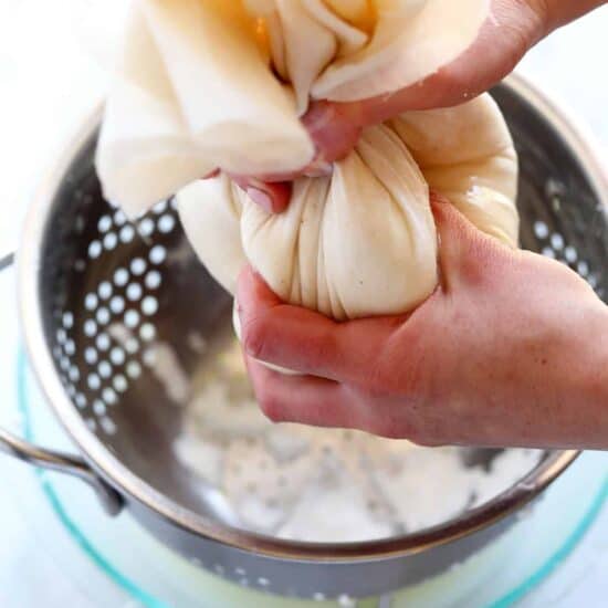 squeezing liquid out of cheesecloth.