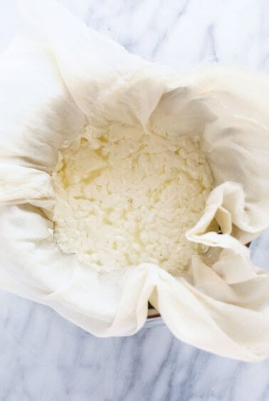 cheese curds in cheesecloth.