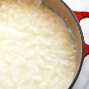 cheese curds floating in pot.