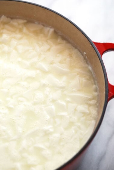 cheese curds floating in pot.