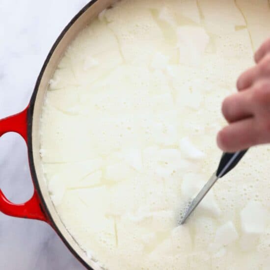 curd in pot with knife.