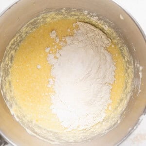 A mixing bowl with lemon ricotta cake batter in it.