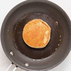 cooking pancakes in skillet.