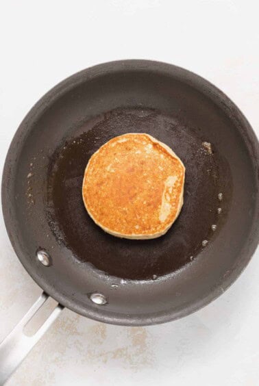 cooking pancakes in skillet.