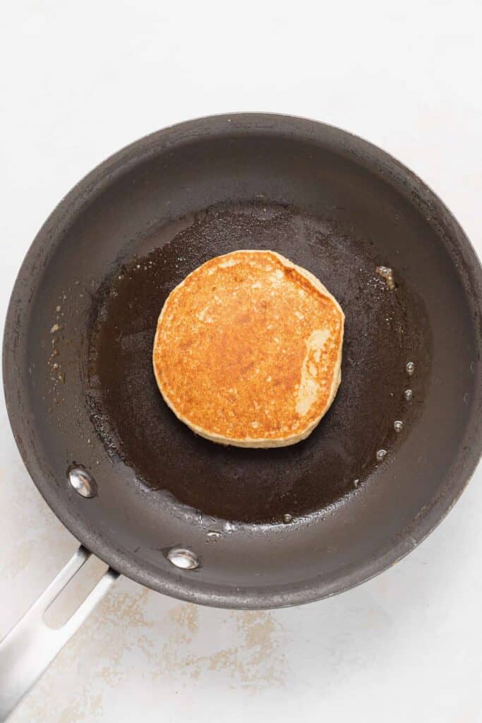 A cottage cheese pancake on a skillet. 