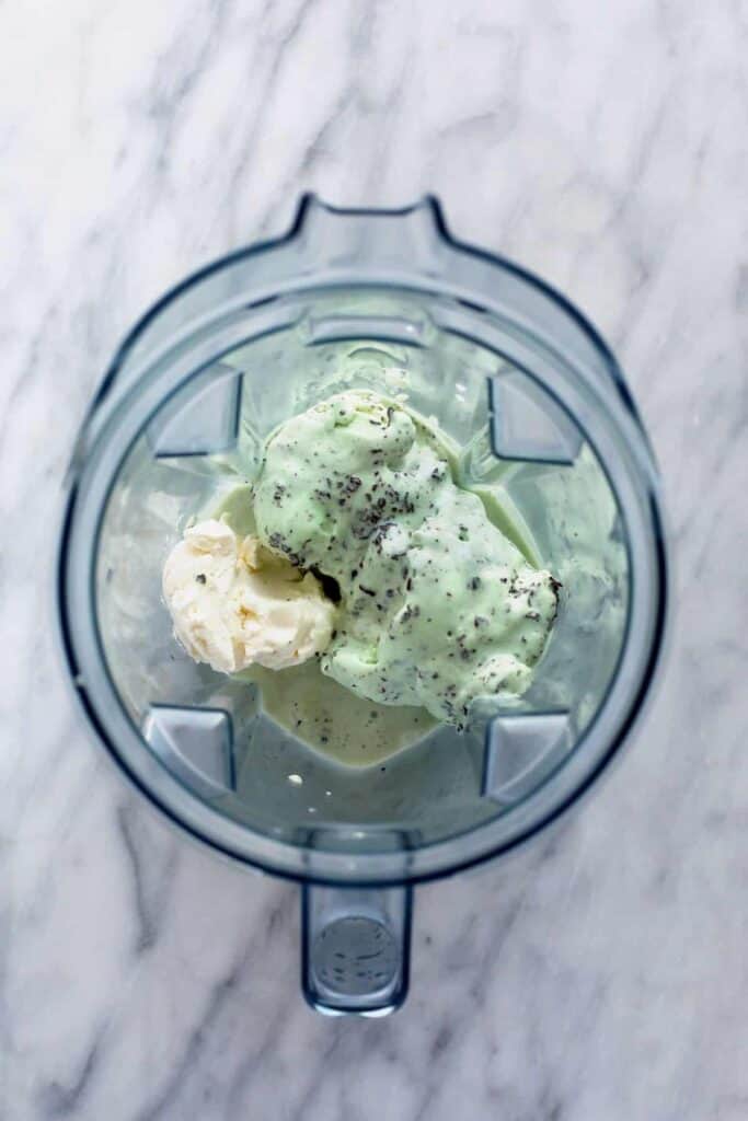 Ingredients for a shamrock shake in a blender. 