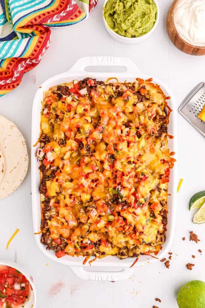 Taco lasagna in a casserole dish. 