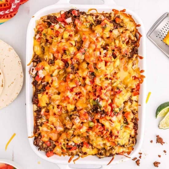 Taco lasagna in a casserole dish.