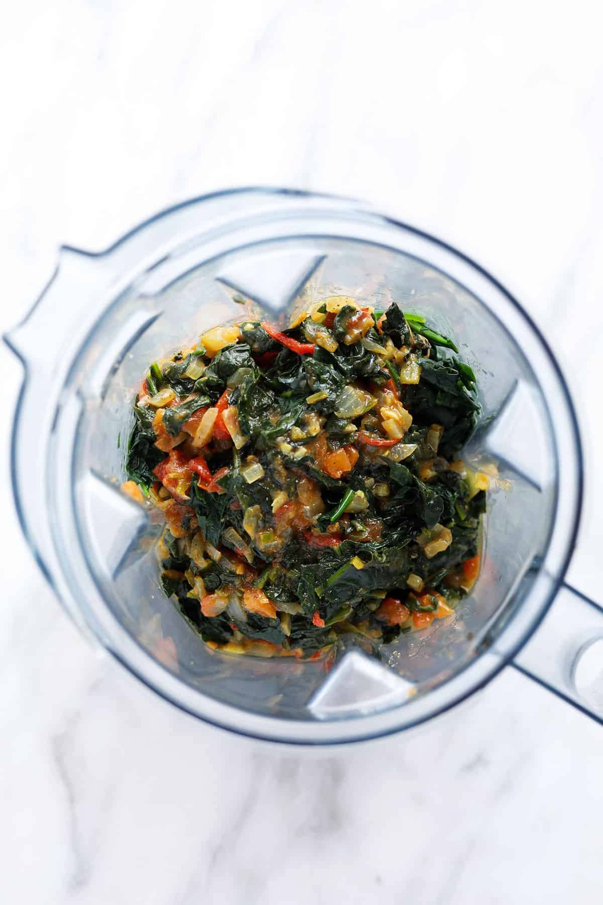 Ingredients for palak paneer in a blender. 