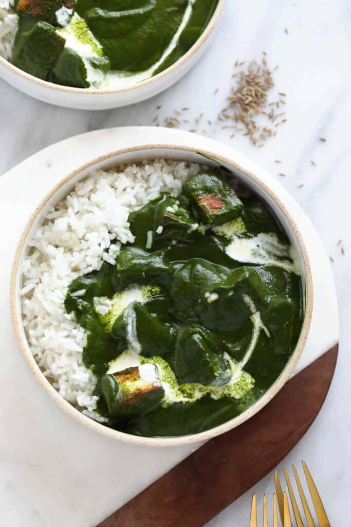 Palak paneer in a bowl with rice. 