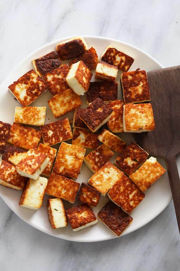 Fried paneer on a plate. 