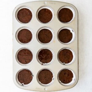 chocolate cupcakes in a muffin tin.