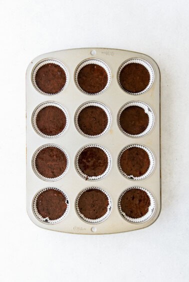 chocolate cupcakes in a muffin tin.