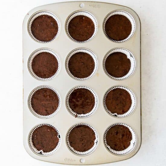 chocolate cupcakes in a muffin tin.