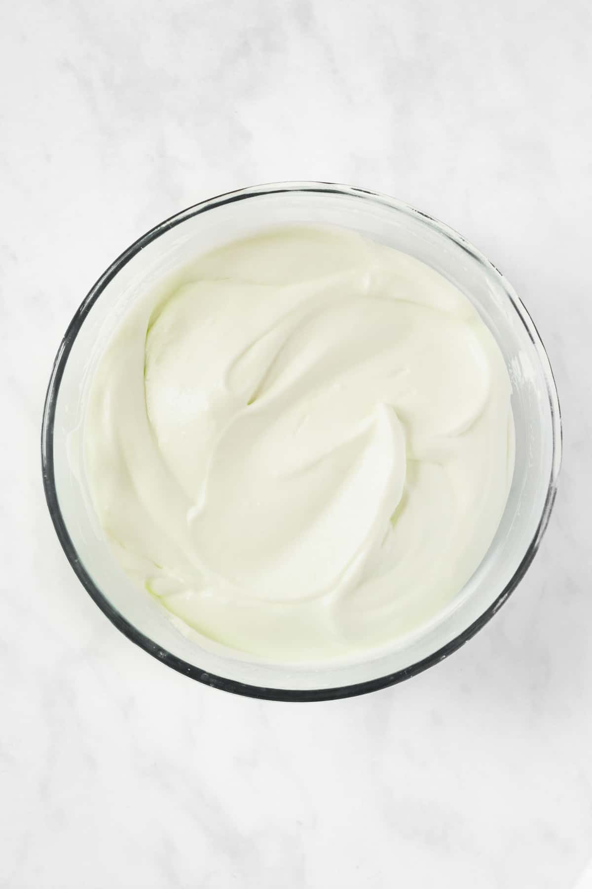 A bowl of cream cheese pie filling. 