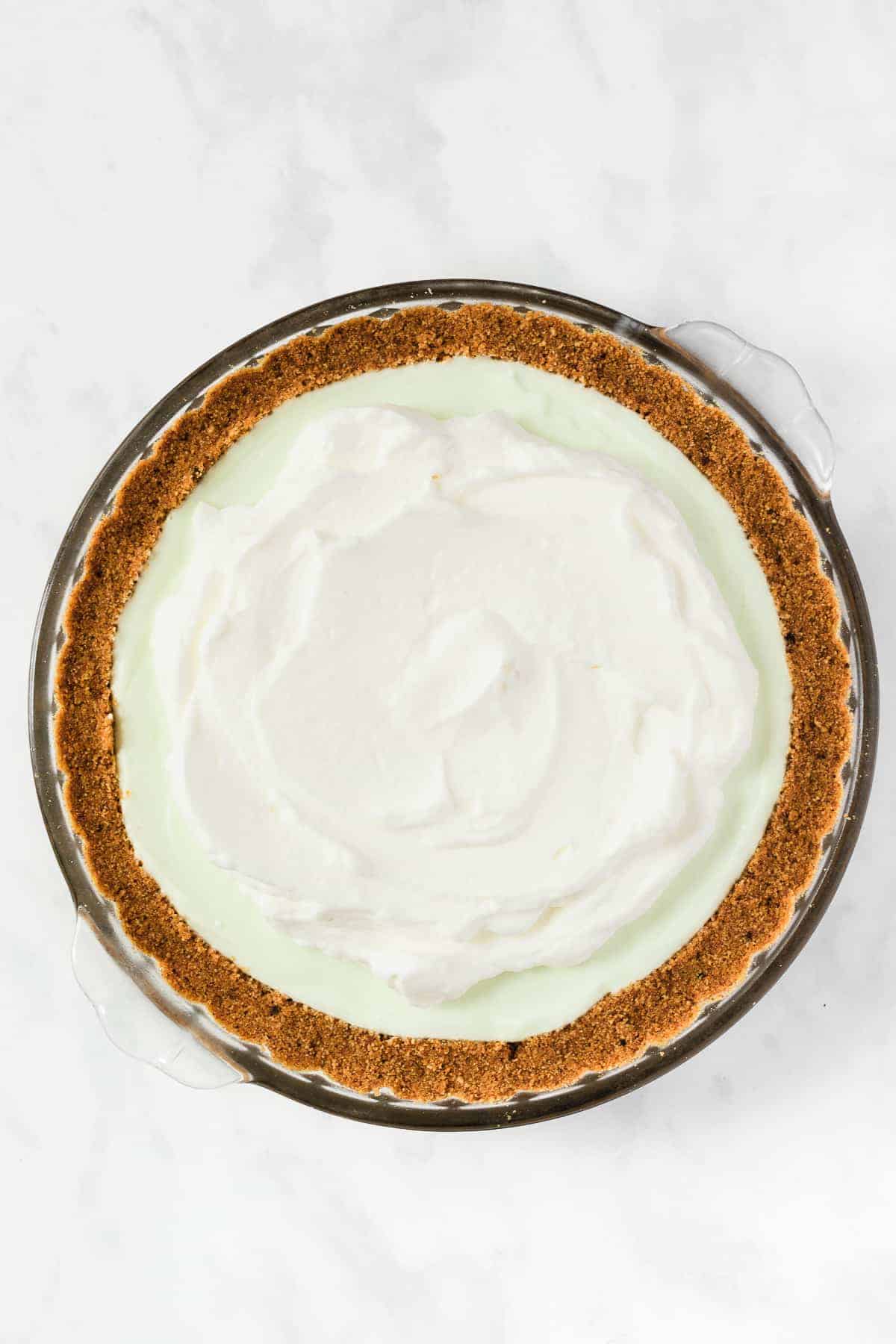 Key Lime Pie with whipped topping ontop. 