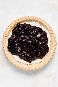 Blueberry topping on cream cheese filling.