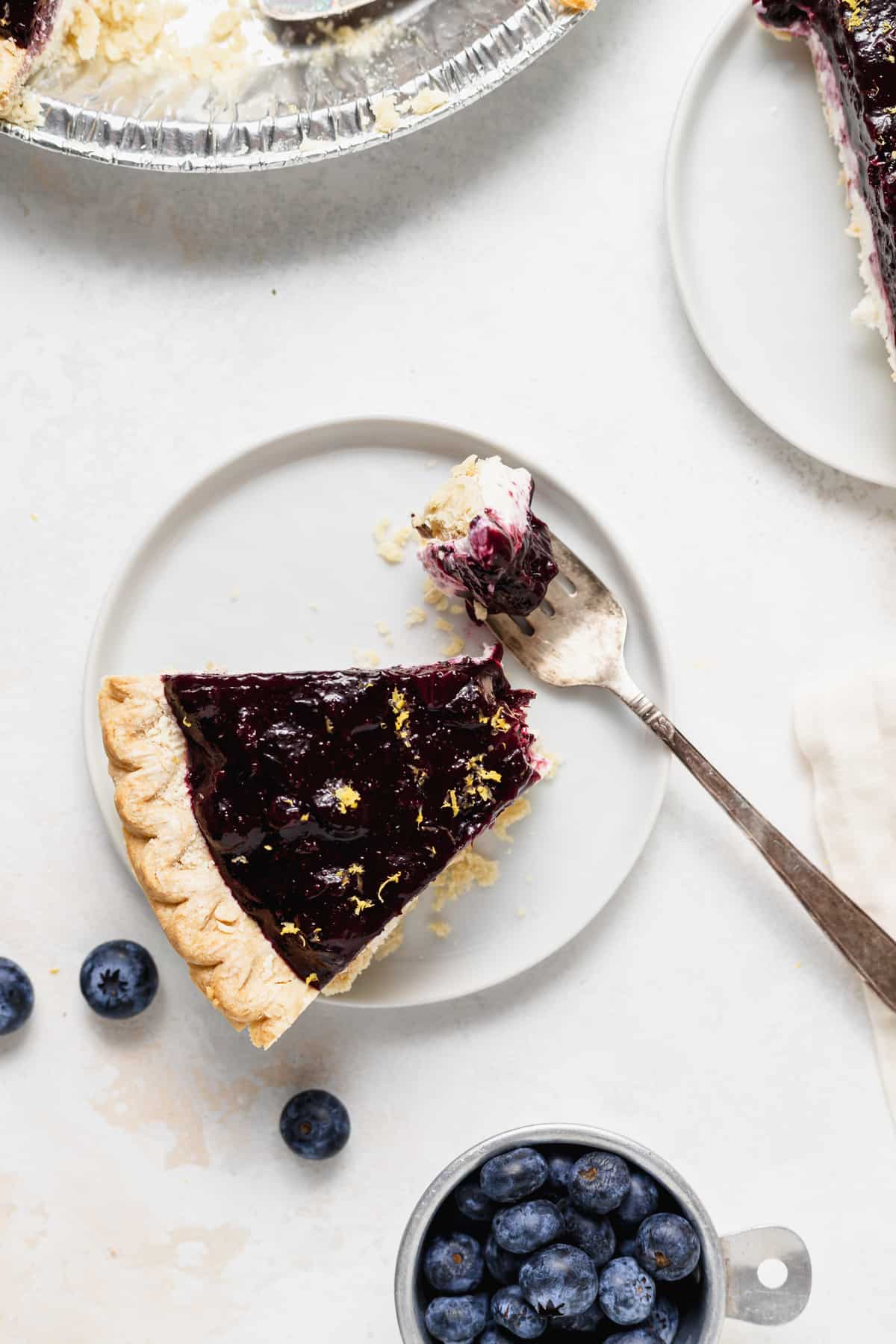 Blueberry cream cheese pie on a plate.