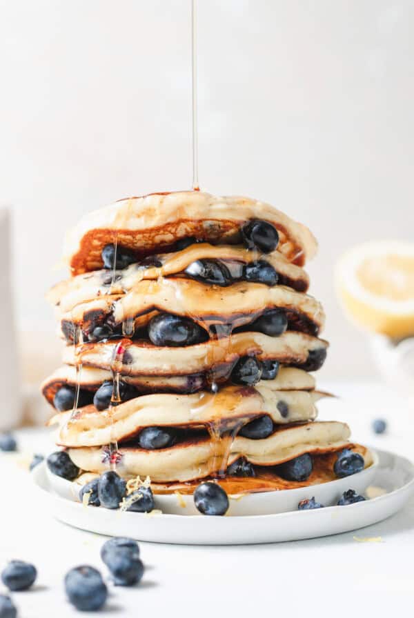 stack of ricotta pancakes on plate