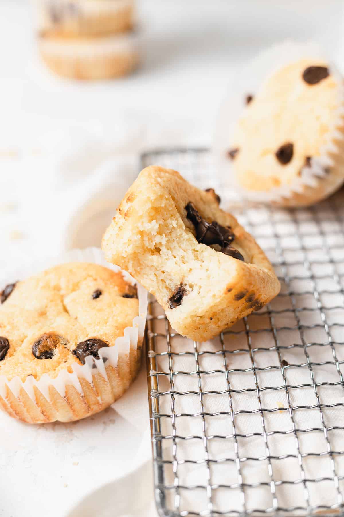 chocolate chip ricotta muffin with a bite taken out of it.