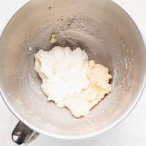 a metal mixing bowl filled with whipped chocolate chip ricotta muffins.