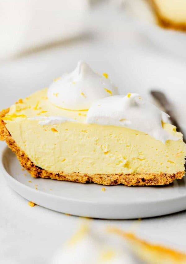 a slice of cream cheese lemonade pie on a plate
