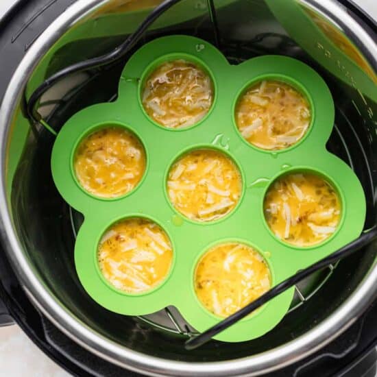 An air fryer filled with cheesy egg bites.
