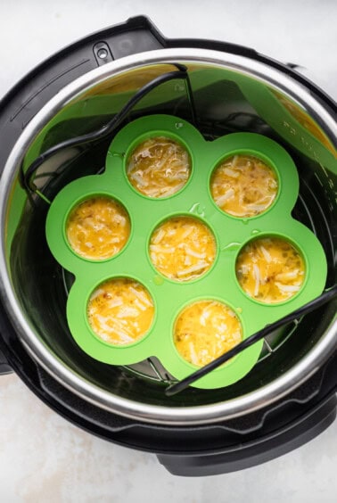 An air fryer filled with cheesy egg bites.