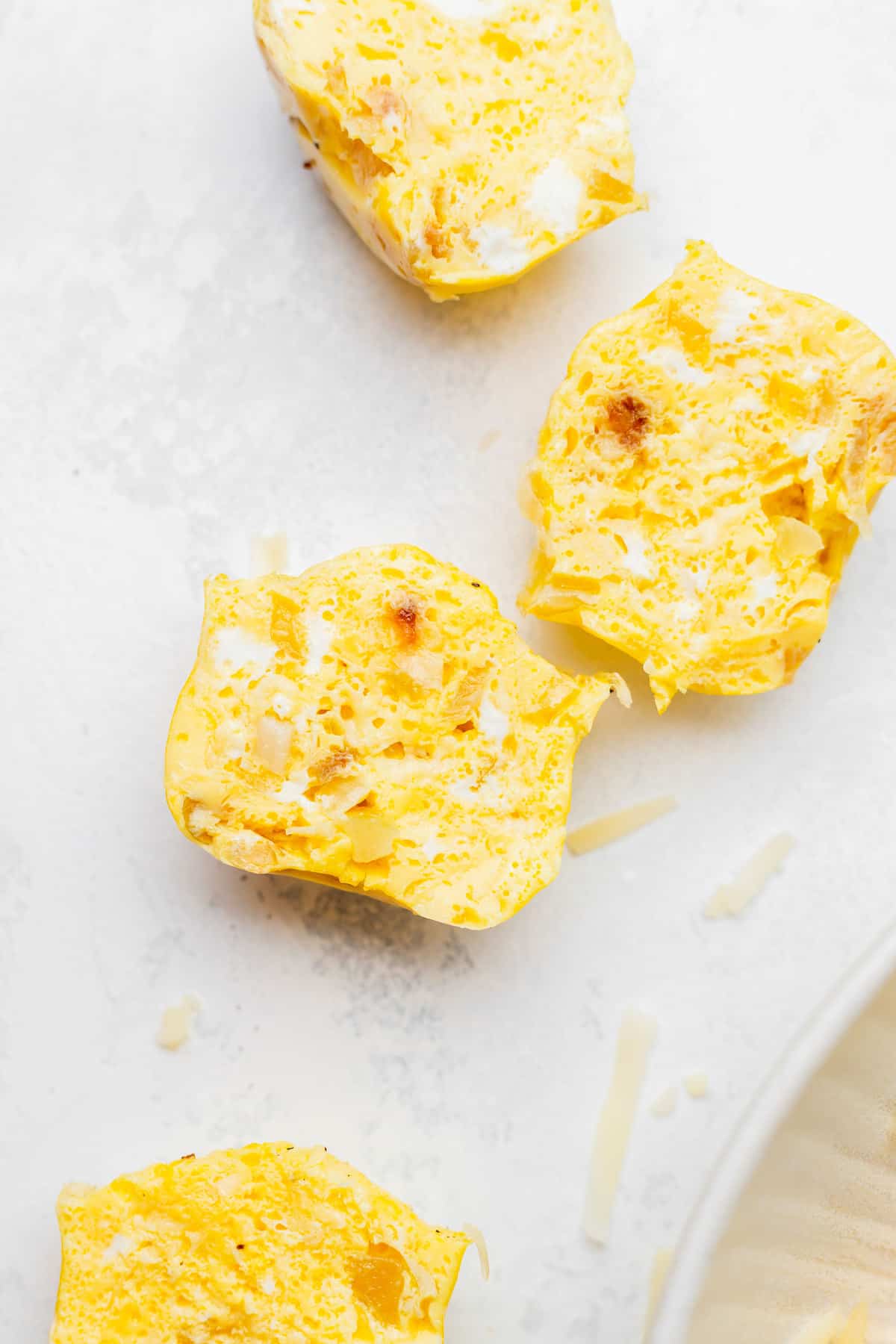 Instant pot cheesy egg bite cut in half looking very fluffy.