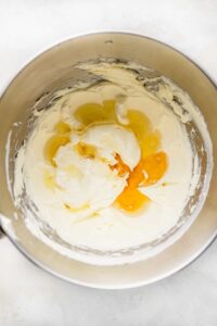 a pan with eggs and cream in it.