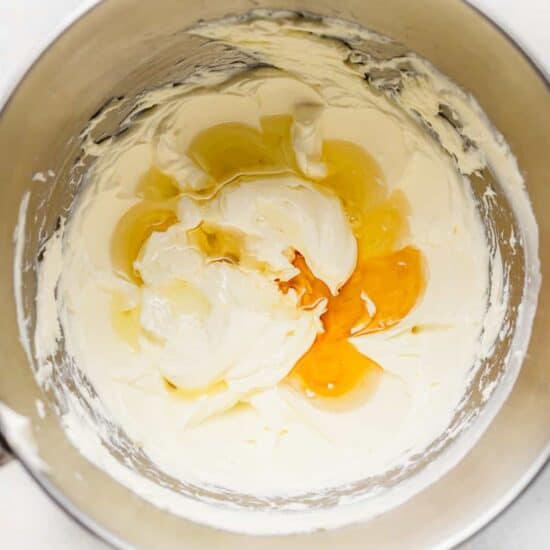 a pan with eggs and cream in it.