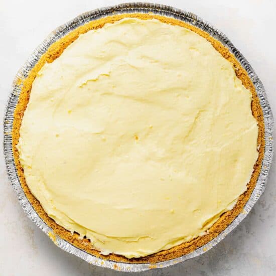 a pie in a pan with a yellow icing.