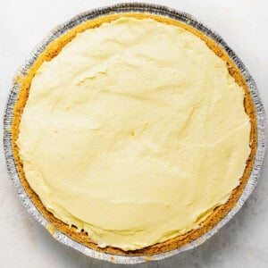 a pie in a pan with a yellow icing.