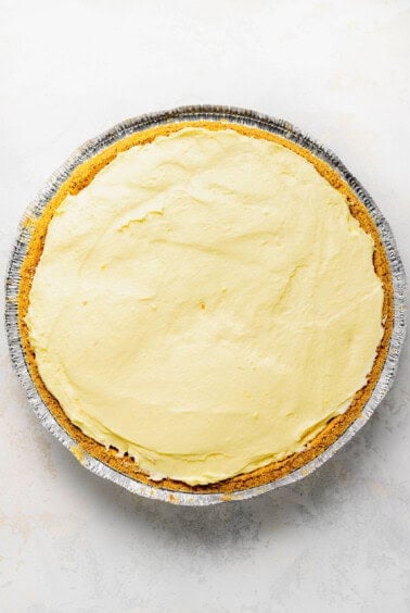 a pie in a pan with a yellow icing.