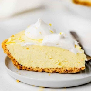 a slice of lemon pie on a plate.