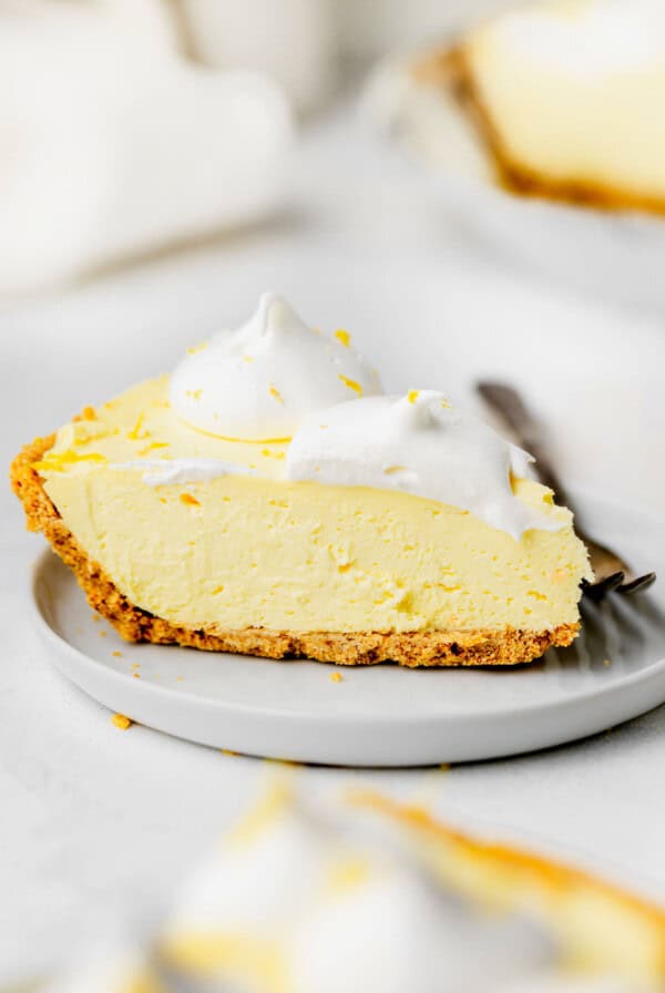 a slice of lemon pie on a plate.