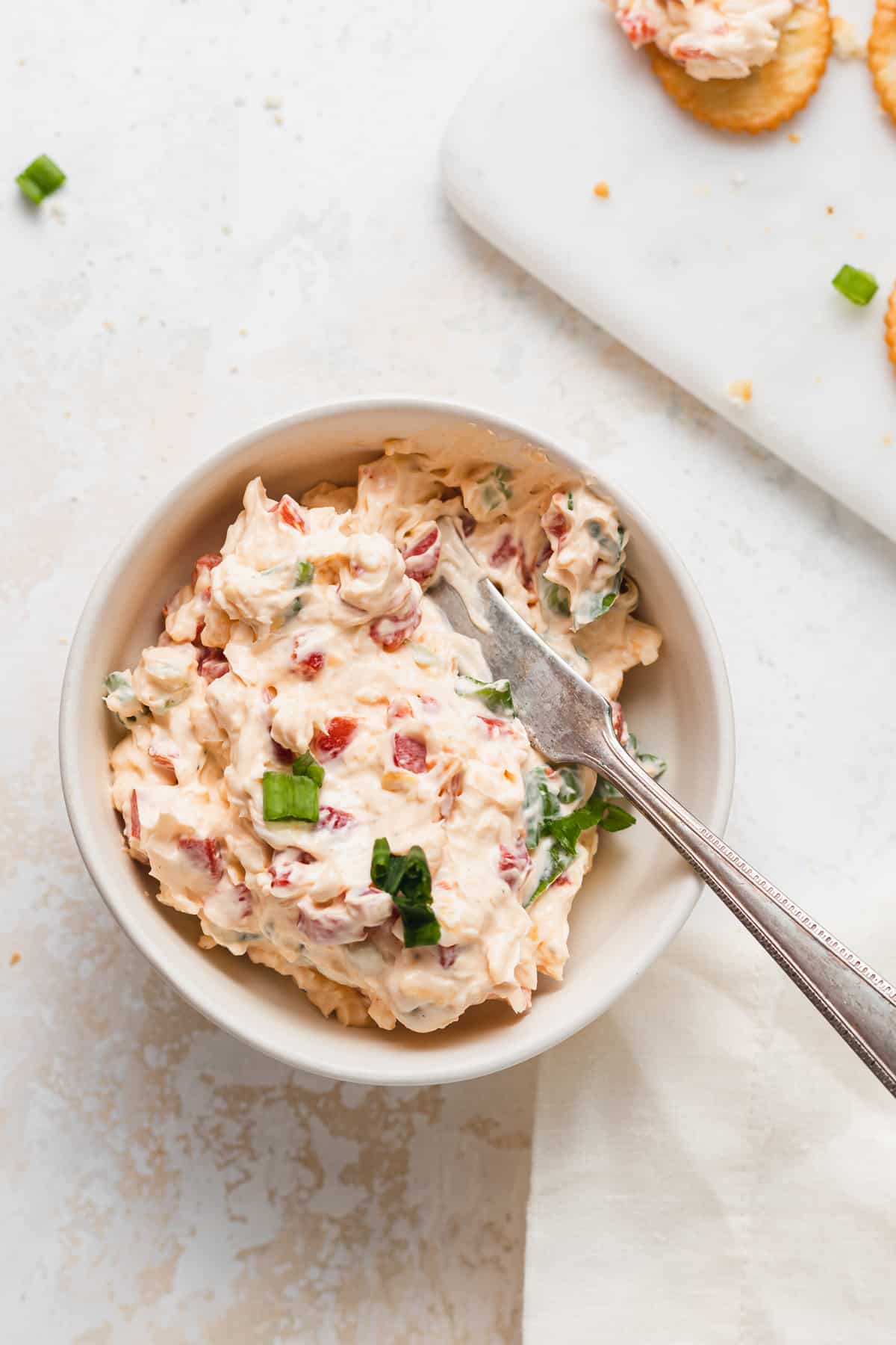 pimento cheese with knife in bowl