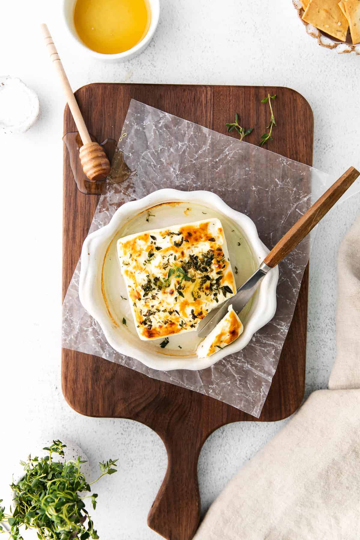 Grilled feta on a charcuterie board. 