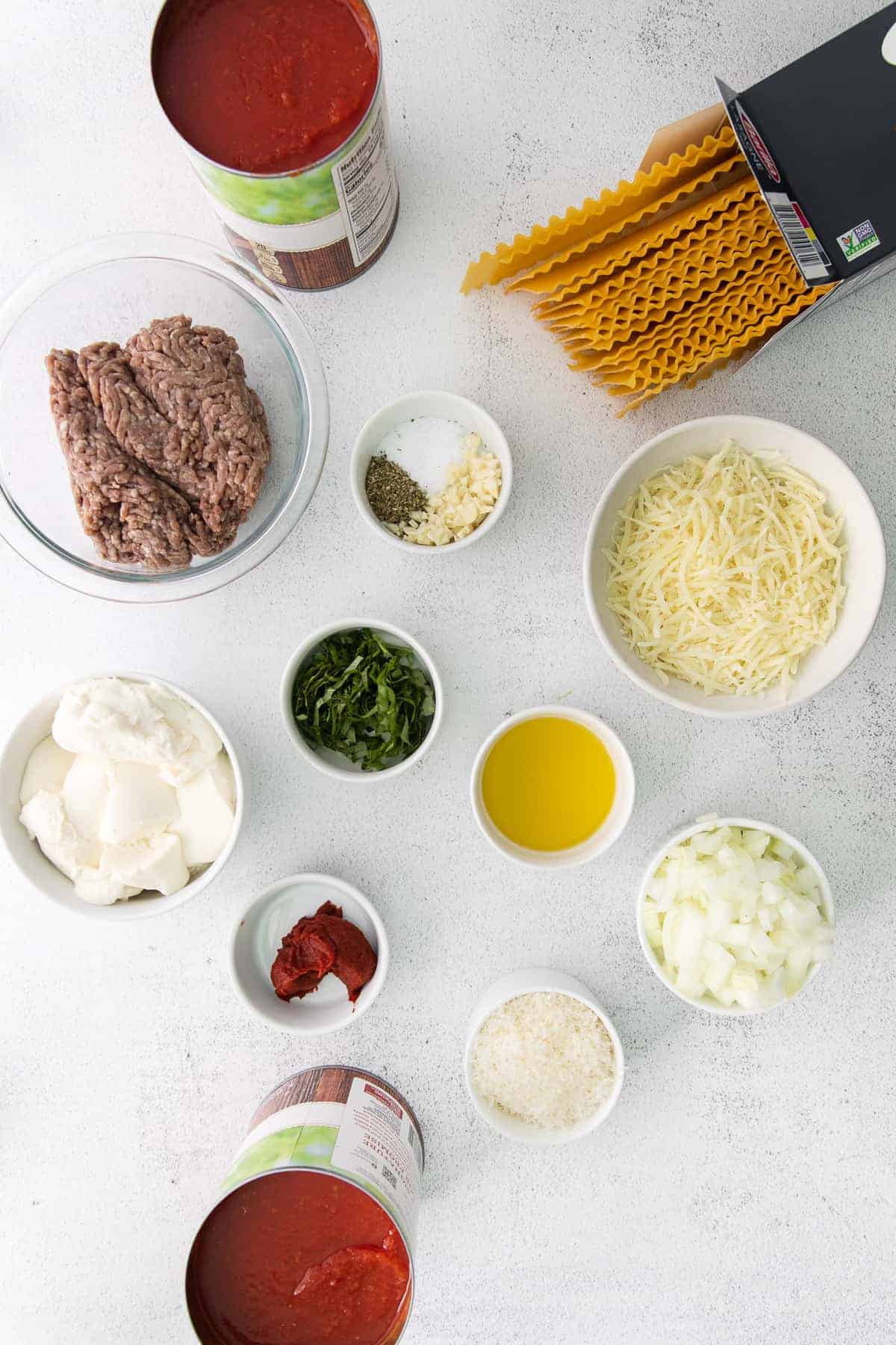 Ingredients for meat lasagna on the countertop. 