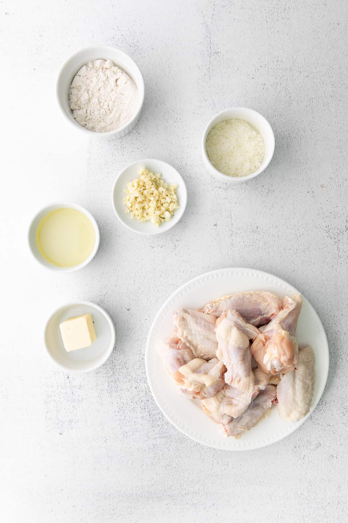 air fryer garlic parmesan wings ingredients, ready to be mixed together