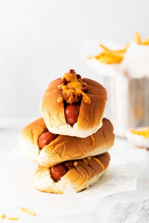 hand holding chili cheese dog