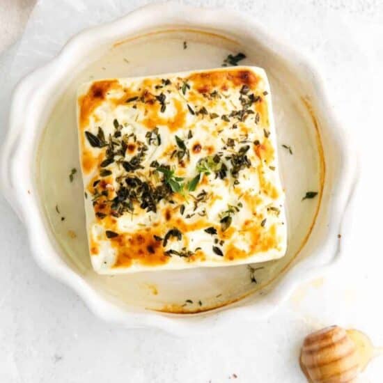 grilled feta cheese in a ramekin