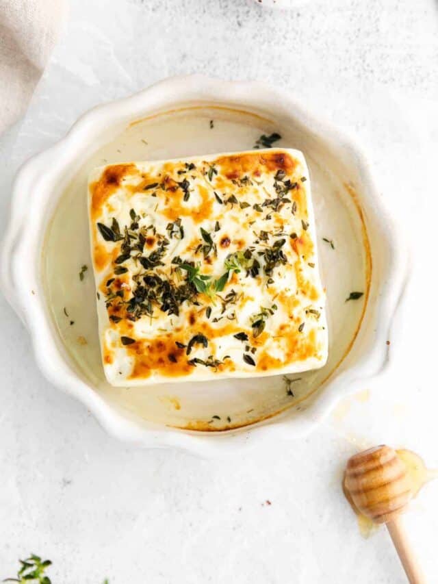 grilled feta cheese in a ramekin.