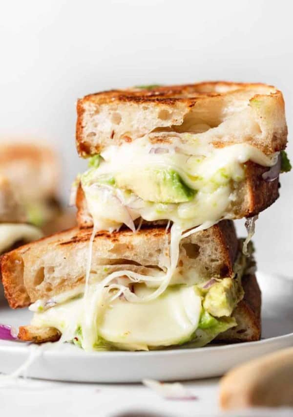 a stack of avocado grilled cheese sandwiches