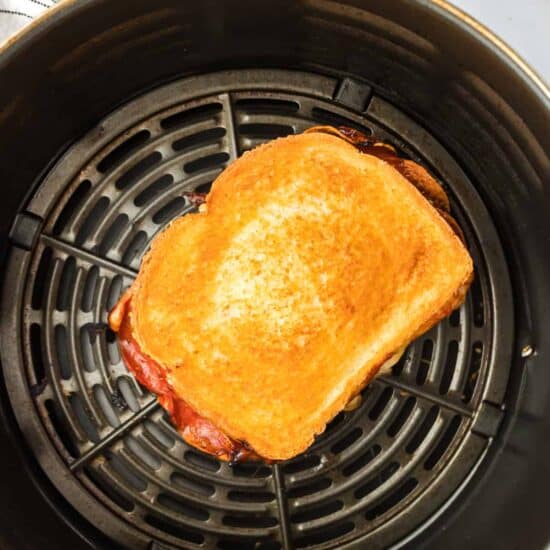a grilled sandwich in an air fryer.