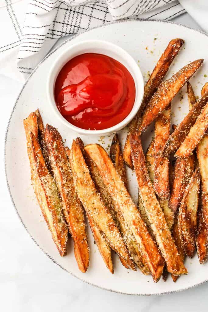 fries on plate with ketchup