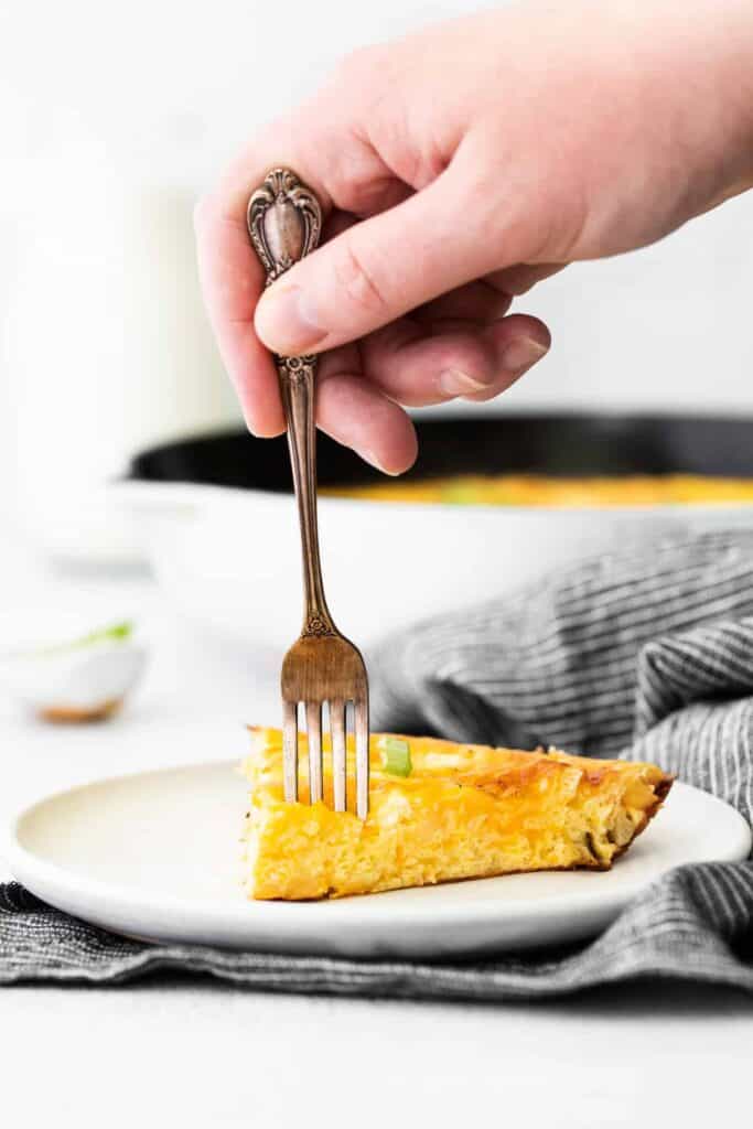 slice of four cheese frittata with a fork