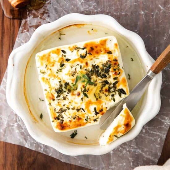 grilled feta in a casserole dish.