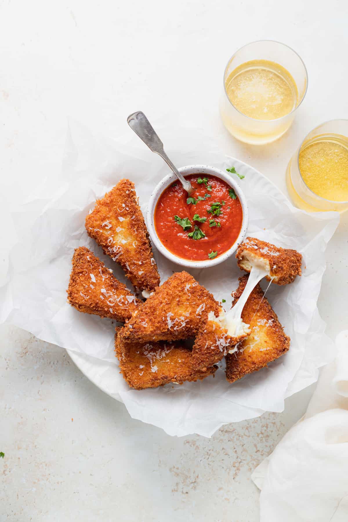 mozzarella in carrozza sandwich triangles with marinara dipping sauce, ready to be served